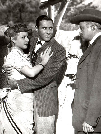 Ann Sheridan as Vermillion O'Toole, Phillip Reed as Newton Cole and Larry Gates as Marshal Ed Daggett in Take Me to Town (1953)