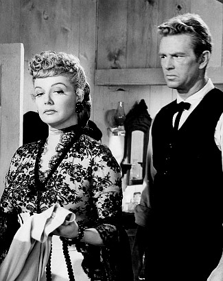 Ann Sheridan as Vermillion O'Toole and Sterling Hayden as Will Hall in Take Me to Town (1953)