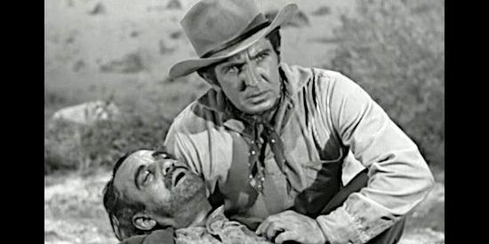 Bob Steele as Bob Coolidge, knowing a dead revolutionary means trouble for the cattle drive in San Antone (1953)