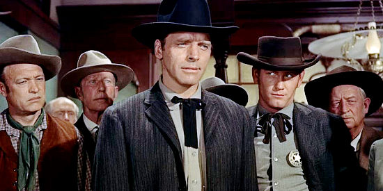 Burt Lancaster as Wyatt Earp and Earl Holliman as Deputy Charles Bassett, cracking down on guns in town in Gunfight at the O.K. Corral (1957)