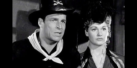 Buster Crabbe as Chad Santee and Ann Robinson as Rose Fargo as bandits attack their stage in Gun Brothers (1956)