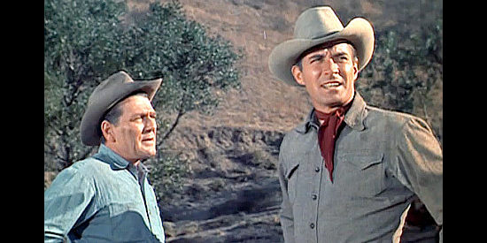 Charles McGraw as Cal Moore and Jock Mahoney as Joe Dakota meet near the oil well in Joe Dakota (1957)