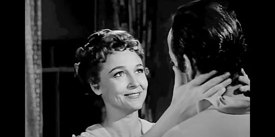 Darlene Fields as Rosa, the saloon girl interested in Velvet and his stolen money in Gunsight Ridge (1957)