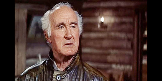 Donald Crisp as Dennis Deneen, a man who won't permit violence in his valley in Saddle the Wind (1958)