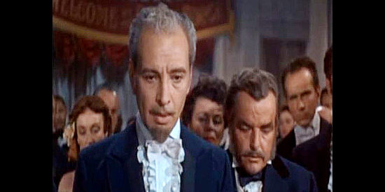 Donald Randolph as Pierre Bonet, a friend of Colby and his father in The Gambler from Natchez (1954)