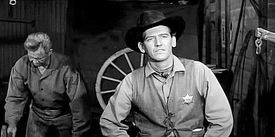 Earle Lyon as Sheriff Gregg Leech, watching three strangers arrive in town in The Silver Star (1955)