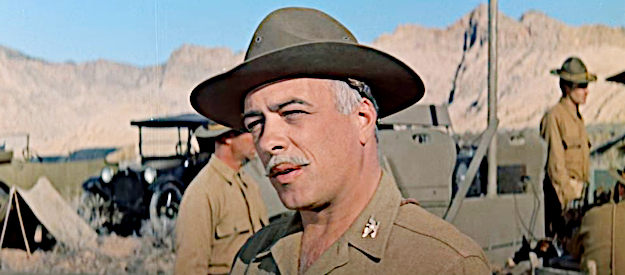 Edward Platt as Col. DeRose, discussing Maj. Thorn's assignment as awards officer in They Came to Cordura (1959)