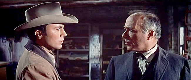 Edward Platt as Purcell Avery (right) informing Davy Hackett (James Darren) that Ed Hackett is suspected of murder in Gunman's Walk (1958)