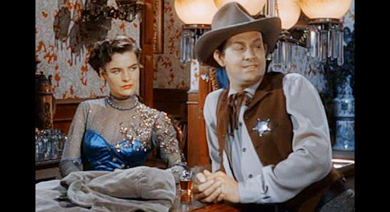 Ella Raines as Nan Morgan and Vaughn Monroe as Rhiannon, getting to know one another in Singing Guns (1950)