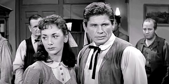 Fintan Meyler as Sally Crane and Charles Bronson as Luke Welch, realizing they aren't welcome at the town dance in Showdown at Boot Hill (1958)