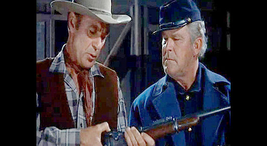 Gary Cooper as Lex Kearney showing one of the new Springfield rifles to Sgt. Snow (Guinn 'Big Boy' Williams) in Springfield Rifle (1952)