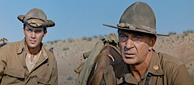 Gary Cooper as Maj. Thomas Thorn, watching the U.S. cavalry attack at the Geary ranch as Pvt. Andrew Hetherington (Mihcale Callan) looks on in They Came to Cordura (1959)