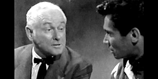 George Macready as Mr. Jefferson, trying to involve Juan Morales in his attempt to make off with the payroll the stagecoach is carrying in Gunfire at Indian Gap (1957)