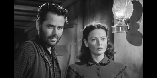 Glenn Ford as Jim Canfield and Gene Tierney as Marcia, watching the women begin to relax around the escapees in The Secret of Convict Lake (1951)