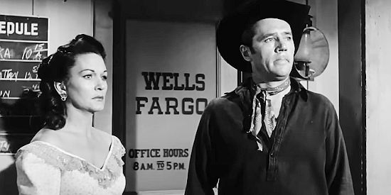 Gloria McGehee as Meg Anderson and Howard Duff as Jess Collins, worried trouble is coming to Colton in Sierra Stranger (1957)