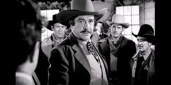 Grant Withers as Wade Proctor, the cattle king trying to chase small ranchers off the range in The Savage Horde (1950)