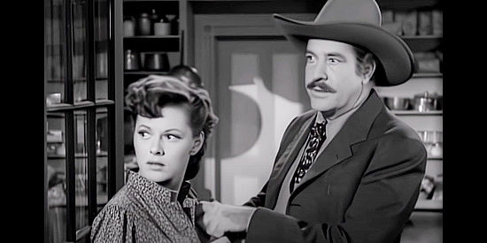 Grant Withers (right) as Wade Proctor with Livvy Weston (Lorna Gray, aka Adrian Booth), the woman he hopes to marry in The Savage Horde (1950)