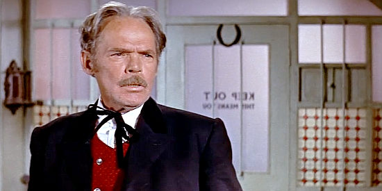 Henry Hull as Doc Masters, the mayor who recruits Tibbs as the new sheriff in The Sheriff of Fractured Jaw (1958)
