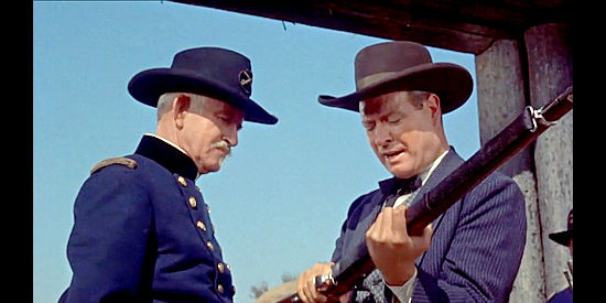 Howard Wright as Gen. Pope, getting a demonstration of the new Springfield rifles from a salesman named Lang in The Gun That Won the West (1955)
