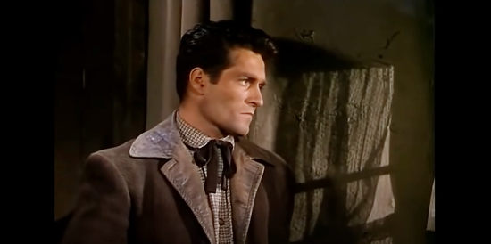 Hugh O'Brian as Tom Kenyon, owner of the way station the Apaches attack in The Stand at Apache River (1953)