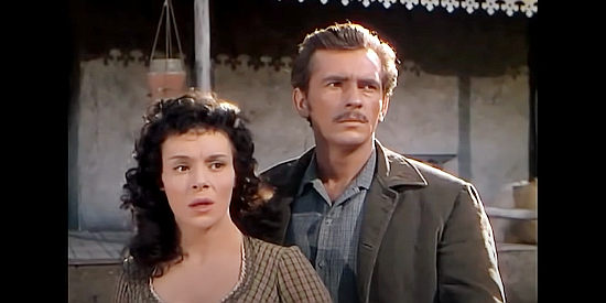Jaclynne Green as Ann Kenyon and Jack Kelly as Hatcher, the man who secretly loves her in The Stand at Apache River (1953)