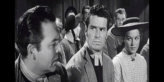 James Garner as John Maitland, scolding buddy Wilber Clegg as Priscilla King looks on in Shoot-out at Medicine Bend (1957)