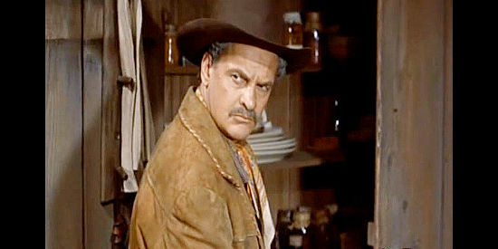 James Gregory as Grimsell, the cattleman who threatening to drive thousands of cattle right through town in Gun Glory (1957)