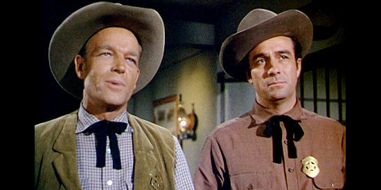 James Mullican as Wyatt Earp and Bruce Cowling as brother Virgil, lawman who believe in Billy Ringo in Gun Belt (1953)