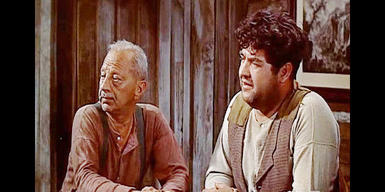 Jay Adler as Hank and Stanley Adams as Joe, the barkeep, both concerned by Larry Venables arrival in Saddle the Wind (1958)