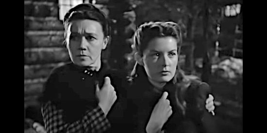 Jeanette Nolan as Harriet Purcell and Barbara Bates as her daughter Barbara, frightened by noises in the night in The Secret of Convict Lake (1951)