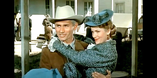 Jeff Chandler as Roy Glennister, tring to keep new arrival Helen Chester (Barbara Britton) out of the mud in The Spoilers (1956)