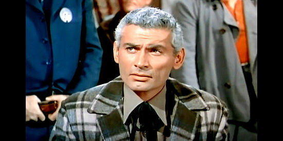 Jeff Chandler as Roy Glennister, wondering if it was wise to let a court decide the fate of his mine in The Spoilers (1956)
