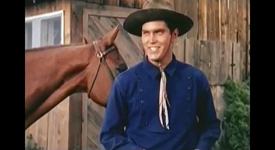 Jeffrey Hunter as Johnny Colt, thrilled to hear he might get a good deal on 40 head of cattle in Three Young Texans (1954)