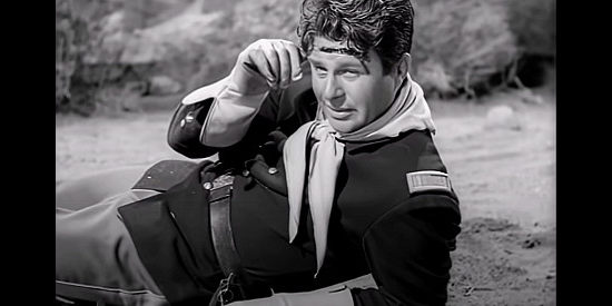 Jim Davis as Lt. Mike Baker, on the trail of his brother, John Baker (aka Ringo) in The Savage Horde (1950)
