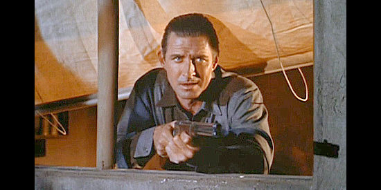 Jock Mahoney as Joe Dakota, defending the property he claims he owns in Joe Dakota (1957)