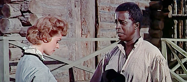 Joel Fluellen as Sam, gets sad news about the white man he's befriended from Kathy Howell (Mary Murphy) in Sitting Bull (1954)