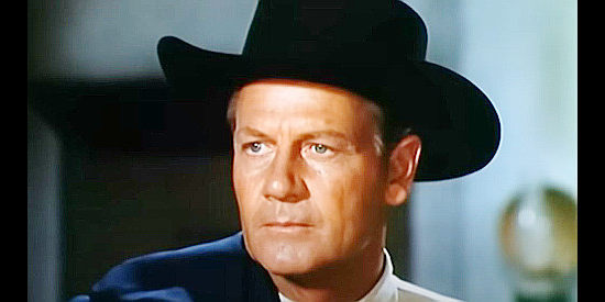 Joel McCrea as Rick Thorne, the judge who arrives in Bannerman determined to dole out justice, even to a Bannerman in Stranger on Horseback (1955)