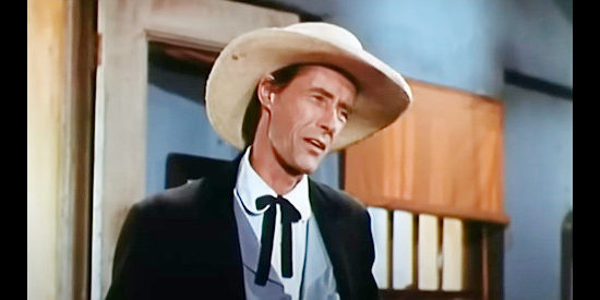 John Carradine as Col. Buck Streeter, a prosecutor under the thumb of Josiah Bannerman in Stranger on Horseback (1955)