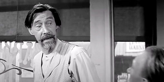 John Carradine as Doc Weber, who also serves at the town barber and undertaker in Showdown at Boot Hill (1958)