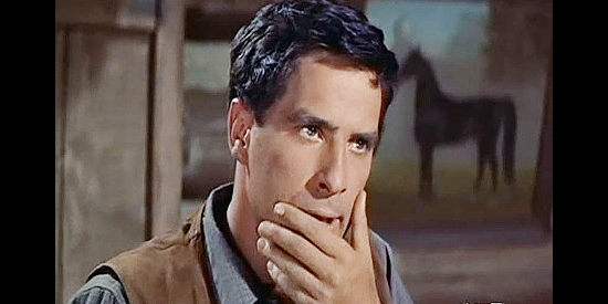 John Cassavetes as Tony Sinclair, reacting to a slap across the face in Saddle the WInd (1958)