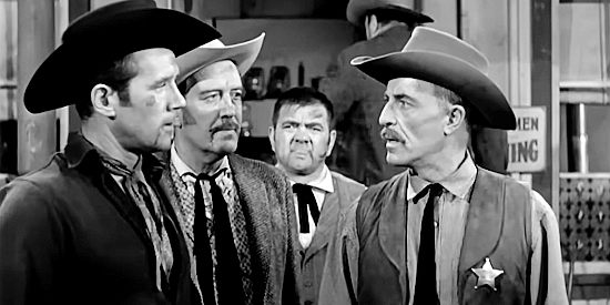 John Hoyt as sheriff of Colton, warning Jess Collins (Howard Duff), Bert Gaines (Dick Foran) and bartender Matt (Henry Kulky) to stay out of trouble in Sierra Stranger (1957)