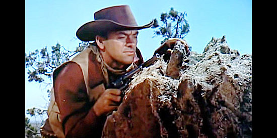 John Ireland as Clint McDonald, the outlaw who pretends to be a veterinarian in Southwest Passage (1954)