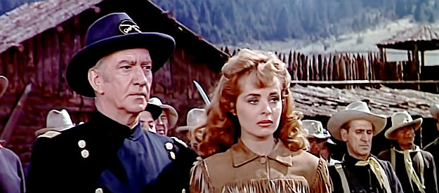 John Litel as Gen. Howell and Mary Murphy as Kathy Howell, wondering about Parrish's fate in Sitting Bull (1954)