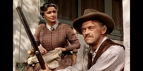 John McEntire as Jess Higgins with his wife Ma (Jeanette Nolan), watching an approaching stranger in Saddle Tramp (1950)