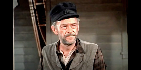 John McIntire as Dextry, Roy Glennister's longtime partner, wary of claim jumpers in The Spoilers (1956)