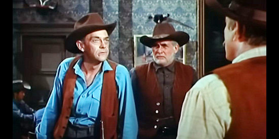 John McIntire as Josiah Bannerman, trying to decide how to deal with a judge who won't take his orders in Stranger on Horseback (1955)