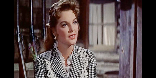 Julie London as Joan Blake, the saloon singer Tony Sinclair brings back from Julestown in Saddle the Wind (1958)