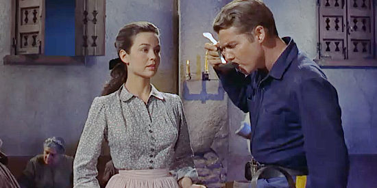 Kathyrn Grant as Anne Martin, having Lt. Frank Hewitt (Audie Murphy) check out her cooking skills in The Guns for Fort Petticoat (1957)