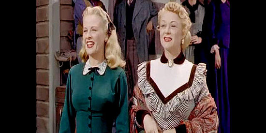 Kay Buckley as Kate Crocker and Sally Ellers as Annie Benson find something to cheer about in Stage to Tucson (1950)