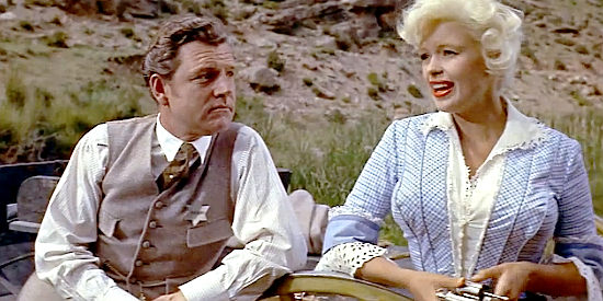 Kenneth Moore as Jonathan Tibbs and Jayne Mansfield as Kate, sharing a quiet moment in The Sheriff of Fractured Jaw (1958)